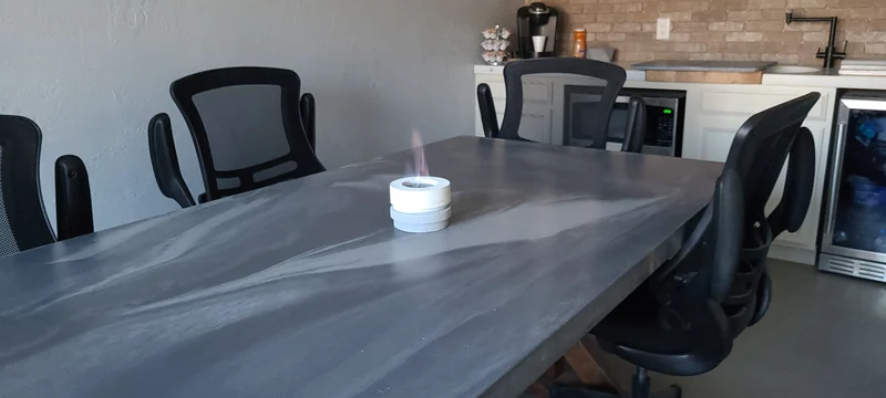 ACC conference table with a gray concrete surface